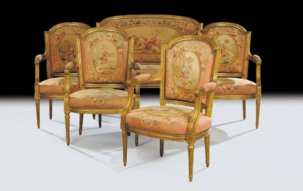 Salotto in stile Luigi XVI composto da quattro poltrone e divano in legno intagliato e dorato, Francia, XIX secolo