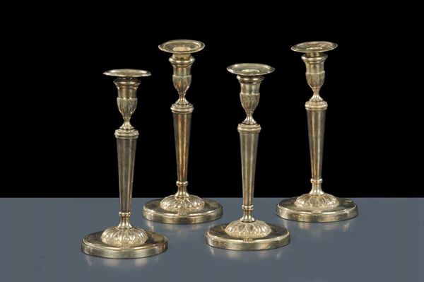 Quattro candelieri in argento con base circolare, bottega di O.Pini Firenze o Livorno inizio XIX secolo