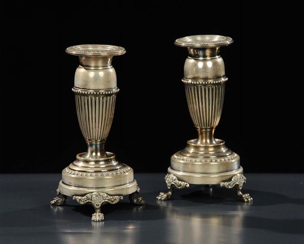 Coppia di candelieri in argento, gr. 480