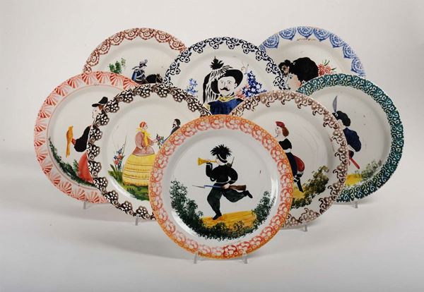 Lotto di otto piatti in ceramica decorati ad arte povera con soggetti diversi, fine XIX secolo