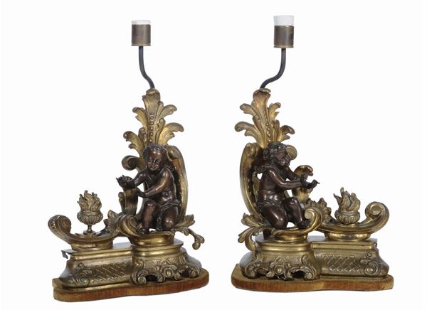 Coppia di alari in bronzo con putti trasformati in lampada, Francia XIX secolo