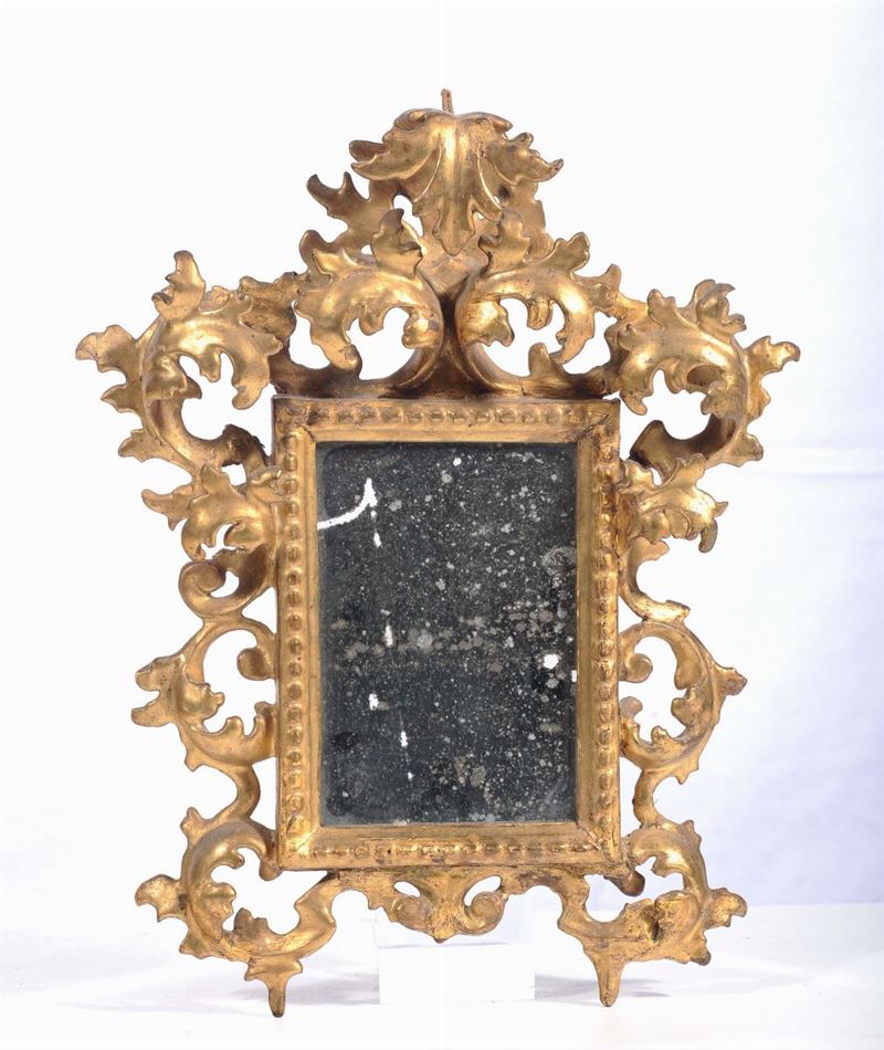 Specchierina con cornice in legno riccamente intagliato e dorato  - Asta Antiquariato e Dipinti Antichi - Cambi Casa d'Aste