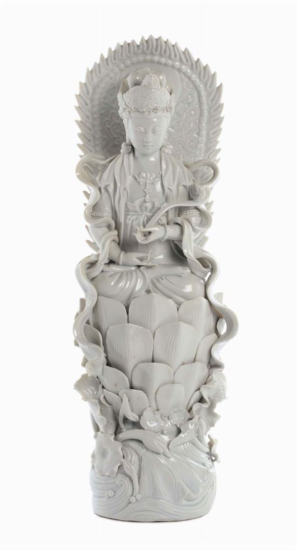 Blanc de Chine Dehau porcelain representing a Guanyin sitting on a lotus flower, China, Qing Dynasty, end 19th century