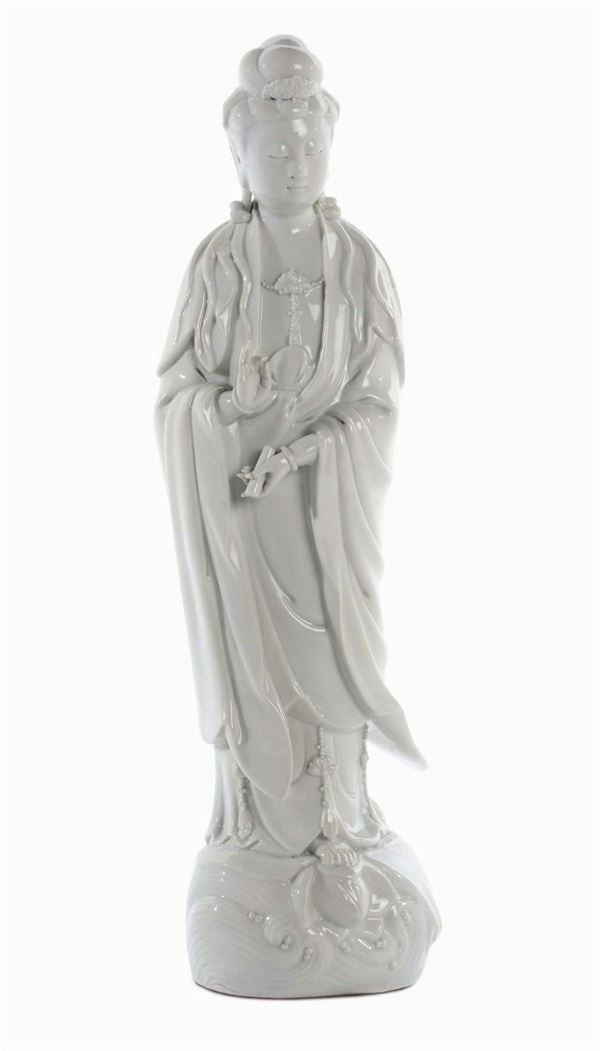 Blanc de Chine Dehau porcelain standing Guanyin with scroll in her hands, China, Qing Dynasty, 19th century