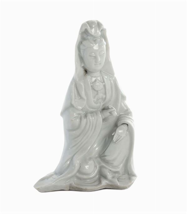 Blanc de Chine Dehua porcelain Guanyin sitting with scroll in her hands and hood, China, Qing Dynasty, end 17th century