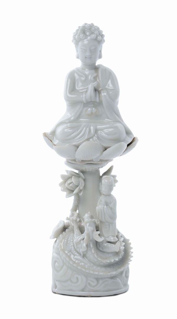 Blanc de Chine Dehua porcelain Buddha on a base of lotus flowers and children figures, China, Qing Dynasty, end 17th century
