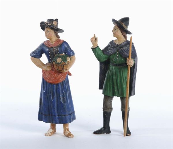 Due statuine da presepe in legno intagliato