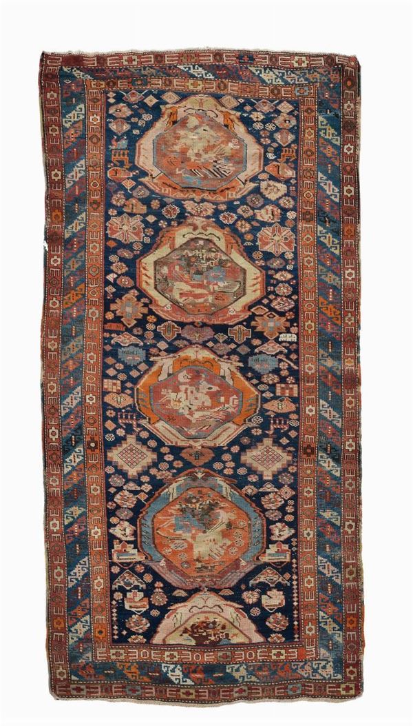 A caucasian long rug late 19th century.Datated pile evenly lower.