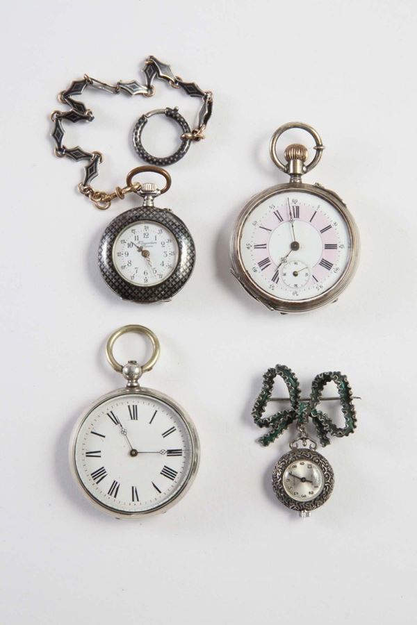 Lotto composto da quattro orologi da tasca in argento, niello e lega argentata