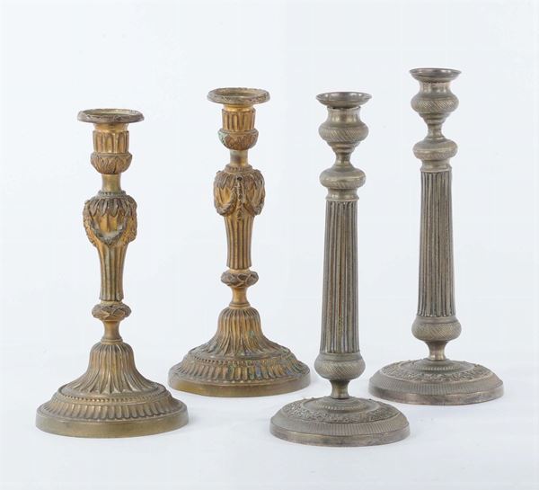 Sei candelieri in bronzo e metallo
