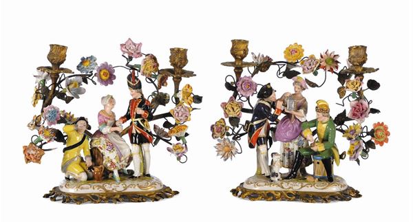 Due gruppi in porcellana e bronzo a foggia di candelieri a due fiamme, Francia XIX secolo