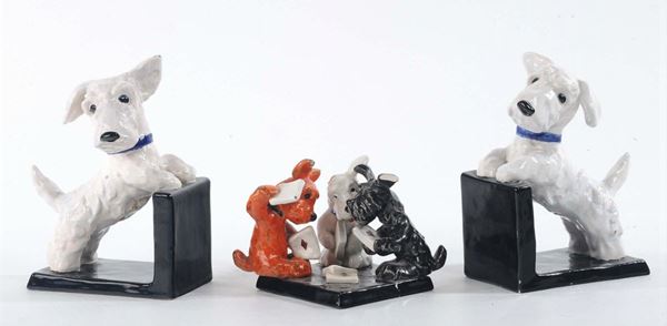 Coppia di fermalibri in ceramica con cani