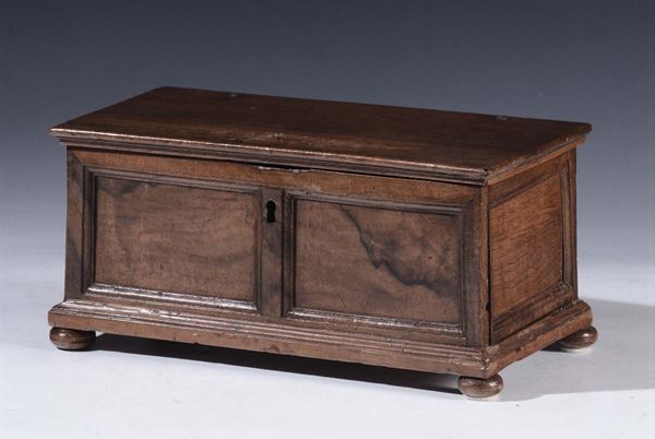 A walnut chest model, Tuscany, 17th century, framed front and sides, onion feet, secret lateral compartment