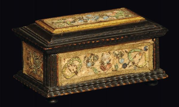 An ebonised and gilt wood rectangular trunk with guilloche frames and embroidered cloth reserves, 17th-18th century