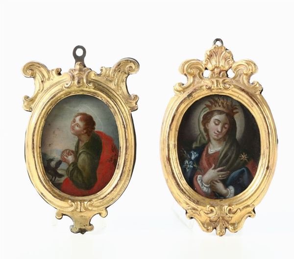Due cornici ovali in rame dorato e sbalzato con motivi a volute, all'interno miniature raffiguranti S.Pietro e Santa Vergine, XVIII secolo