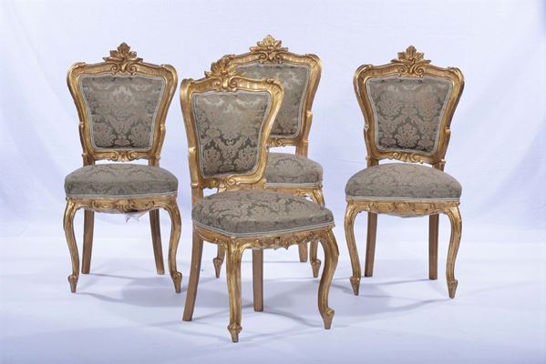 Quattro sedie in legno intagliato e dorato