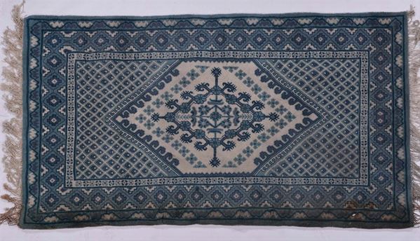 A China rug mid 20th century. One stain of humiditie.