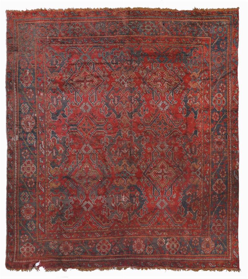 An Ushak carpet early 20th  century. Low piled areas and some damages in one ending.  - Auction Ancient Carpets - Cambi Casa d'Aste