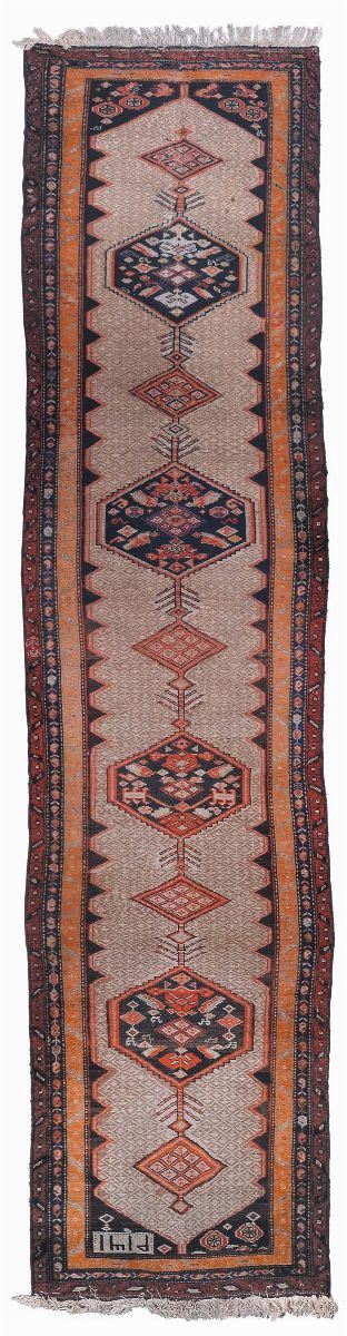 A Northwest Persian runner late 19th century.Dated 1319 good condition.