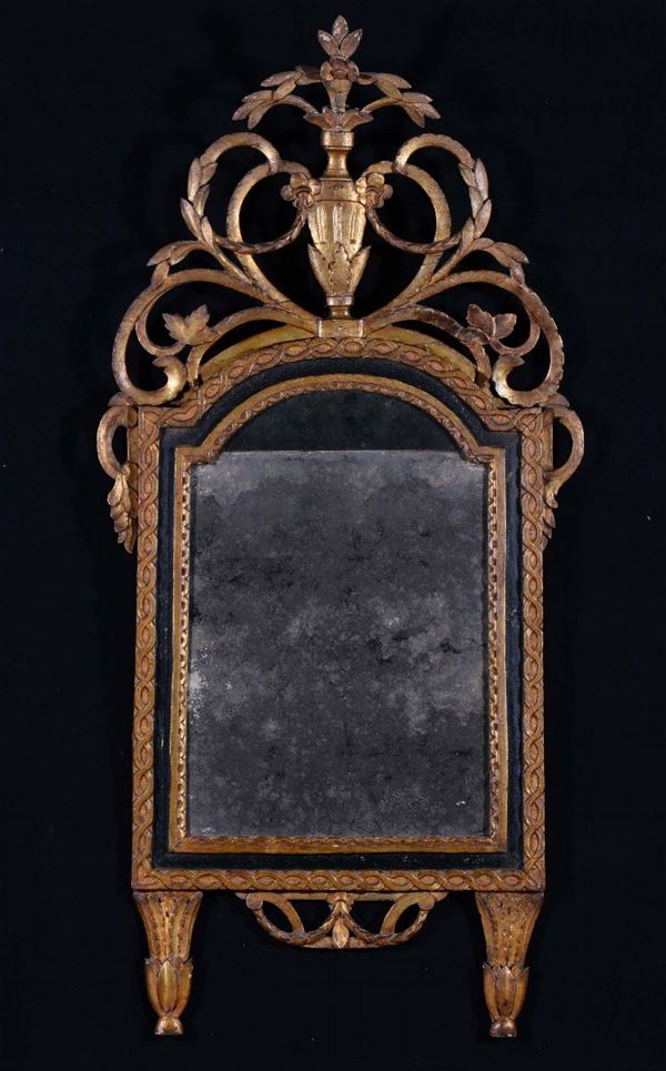 Specchiera Luigi XVI in legno ebanizzato e dorato, XVIII secolo