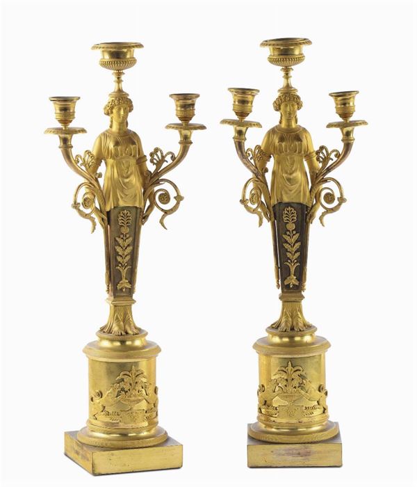 Coppia di flambeaux Impero in bronzo dorato a tre luci, Francia XIX secolo