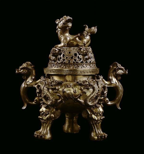 Gilt bronze incense burner, China, 19th century, decorated in relief with dragons, lions and Pho dogs, cm 44x25x48