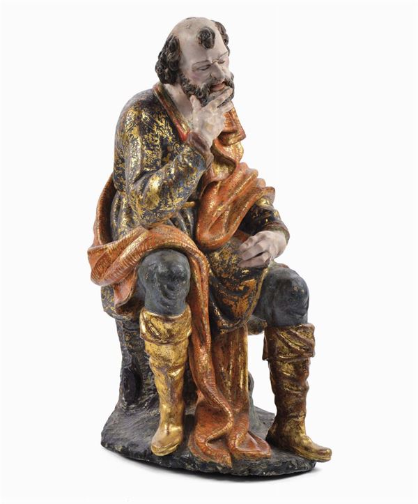 Scultura in legno intagliato e laccato raffigurante uomo seduto, XVIII secolo