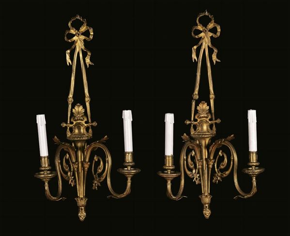 Quattro appliques a due luci Napoleone III in bronzo dorato