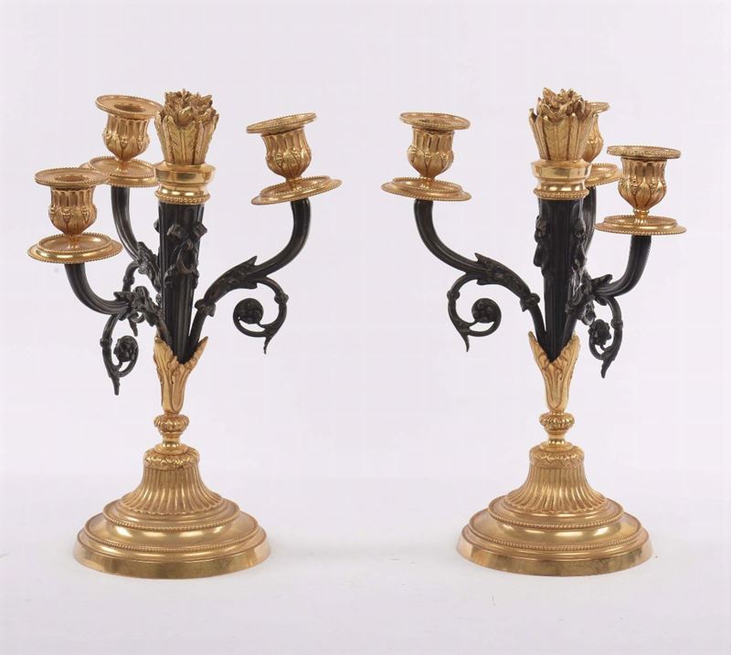 Coppia di candelieri in bronzo brunito e dorato a tre luci  - Auction Time Auction 2-2014 - Cambi Casa d'Aste