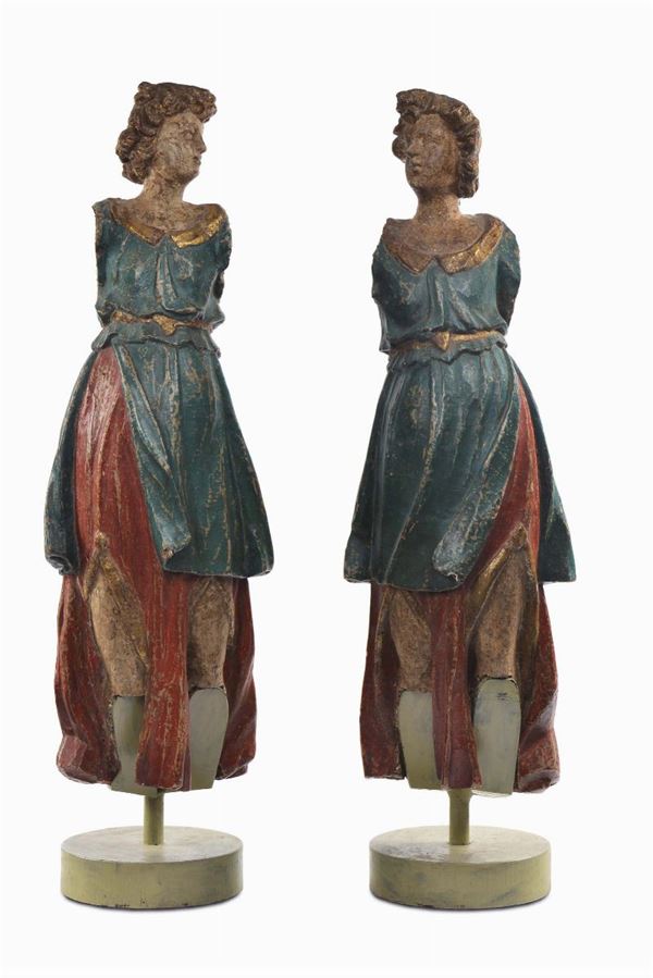 Coppia di sculture in legno intagliato e laccato, Siena XVI-XVII secolo