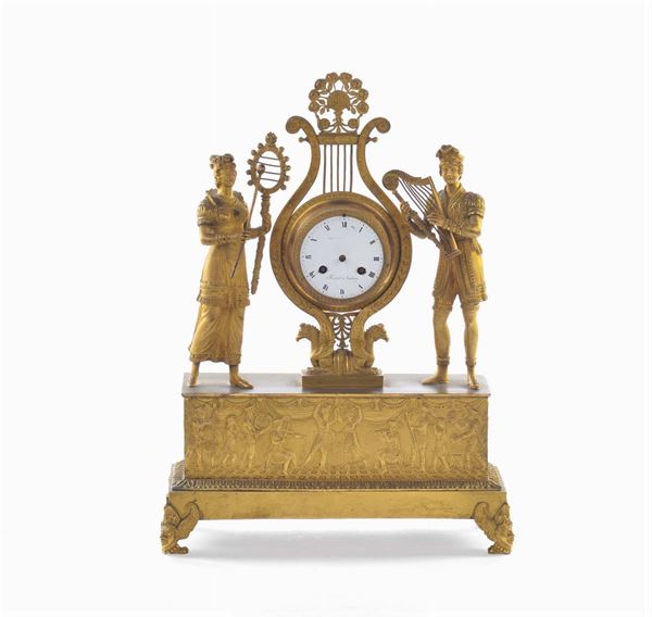 Pendola da tavolo in bronzo dorato raffigurante allegoria della musica, Francia XIX secolo