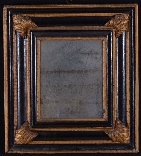 Specchiera in legno ebanizato e dorato, XVIII secolo