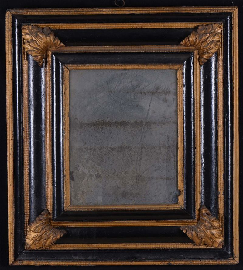 Specchiera in legno ebanizato e dorato, XVIII secolo  - Asta Antiquariato e Dipinti Antichi - Cambi Casa d'Aste