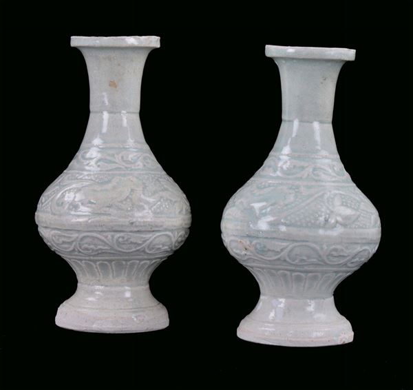Pair of small porcelain vases with light blue background, China, Song Dynasty (960-1279)                        vegetable decoration in relief, h cm 20