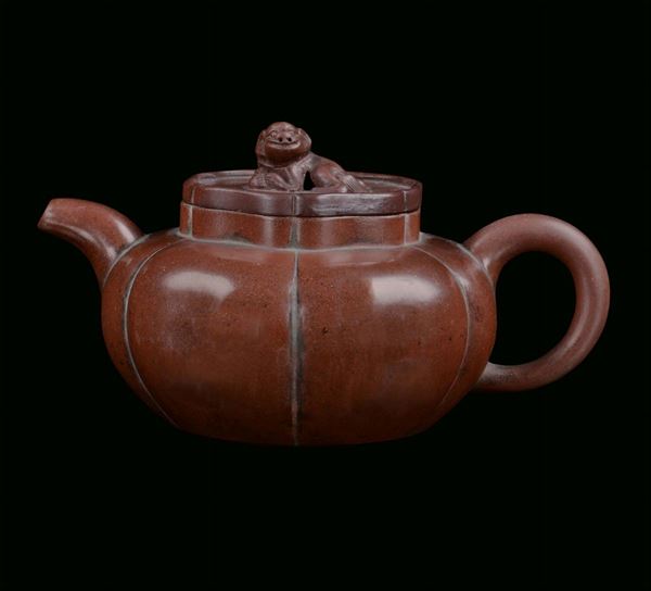 Stoneware pumpkin shaped Yixing teapot, China, Qing Dynasty, 19th century brown background with Pho-dog on the cover, marked, cm 17x11x9
