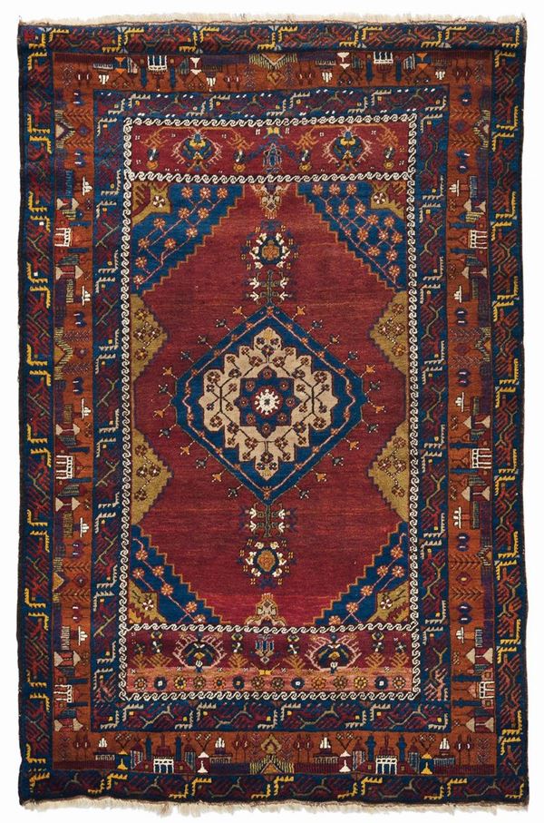 A Anatolia rug early 20th century.Particorally the border whit  a curch