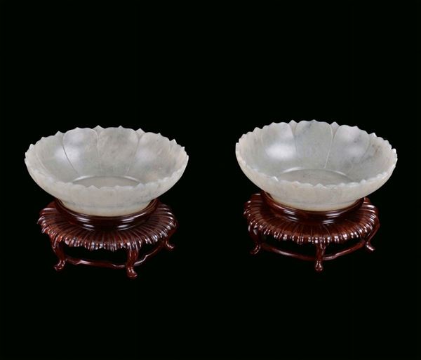 Pair of small white jade Mogul cups with shaped rim, China, 20th century Carved wooden base, diameter cm 14,5