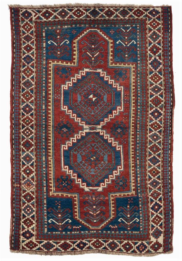 A Caucaso Kazak rug end 19th early 20th century.End reduced.