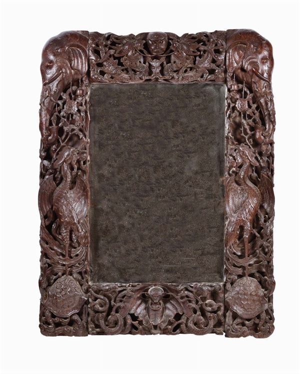A Homu frame carved with elephants, phoenixes, tortoises and vegetable elements, China, Qing Dynasty, 19th century