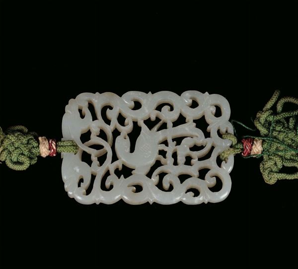 Jade fretworked pendant with spirals and a bird, China, Qing Dynasty, Qianlong Period, end 19th century cm 5,5x3,8