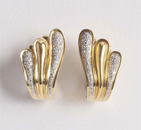 A pair of diamond set earrings