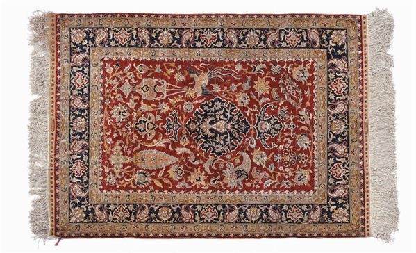 An Anatolia Hereke rug 20th century. Signed Ozonupak very good condition.