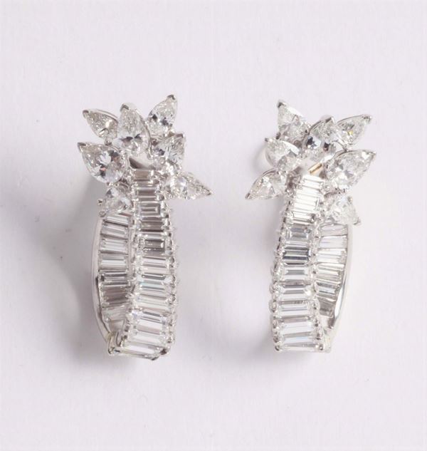 A pair of diamond earrings. Signed Bulgari
