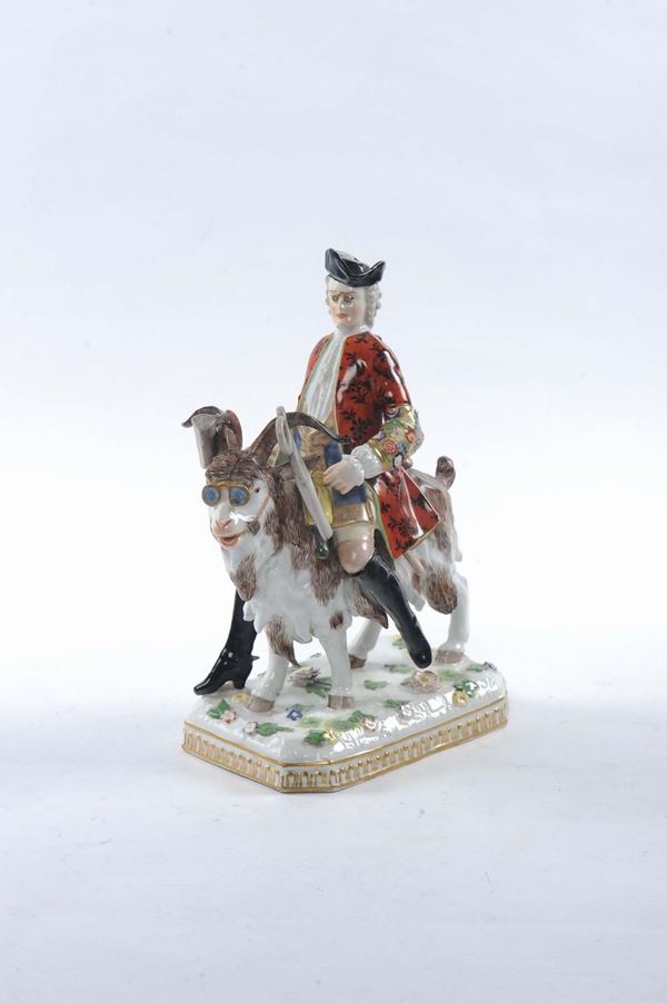 Statuina in porcellana raffigurante figura maschile a cavallo di un caprone