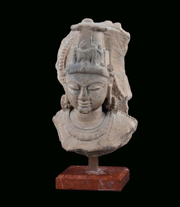 Stone sculpture representing head of Vishnu, India, 13th century cm 19x20x36