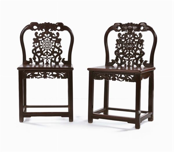 Two Homu wood carved chairs, China, Qing Dynasty, 19th century cm 53x43x52