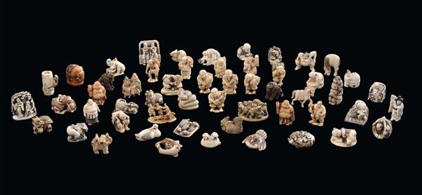 Collection of fifty-four ivory netzuke with various measures, styles and periods, Japan, 20th century