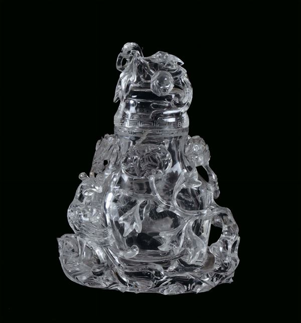 Rock crystal vase carved with naturalistic motives, China, Qing Dynasty, beginning 20th century h cm 21, on carved zitan wooden base