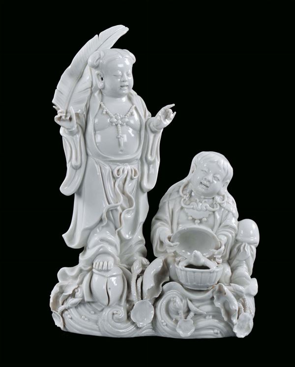 Group with two Blanc de Chine porcelain figures, China, Republican Period, 20th century  cm 25x13x37