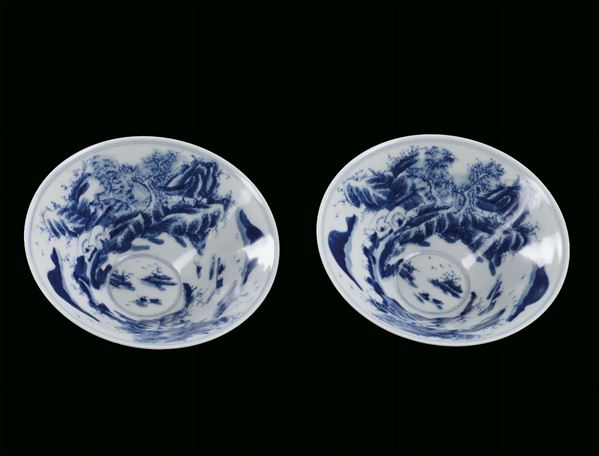 Pair of small porcelain cups, China, Qing Dynasty, 19th century monochrome blue decoration with landscapes inside and outside, four-character mark  diameter cm 12, h cm 5